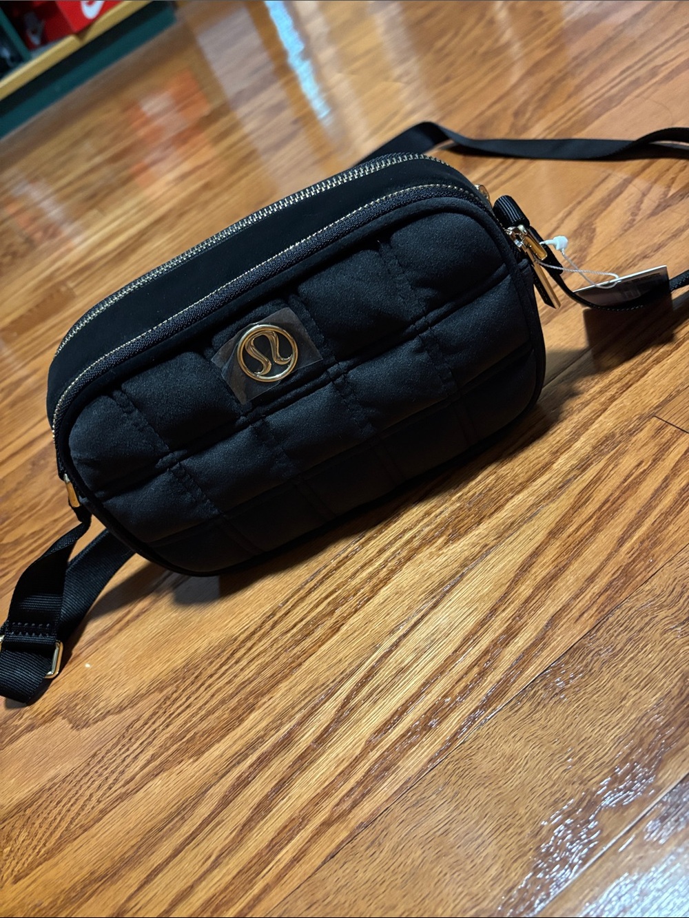 lululemon athletica Black Quilted Crossbody Camera Bag with Gold Accent
